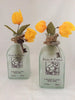 Glass Bottle Vase With Yellow Bougainvillea Flowers